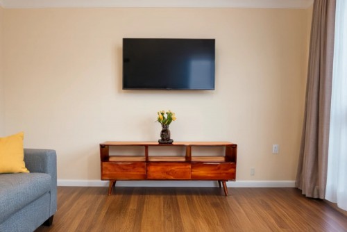 Bizarre three drawer teak finish tv unit